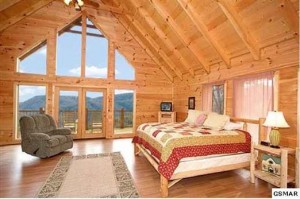 Master bedroom of short sale cabin has fantastic mountain view and ambiance.